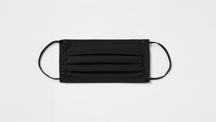 Isolated black sanitary face covering on a white backdrop