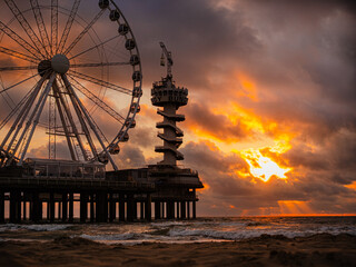 Ferris Wheel Pier at Sunset with Dramatic Sky