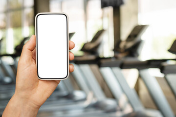 Blurred gym background, sports fitness center with treadmills and exercise equipment in defocus....