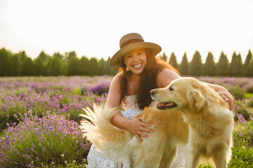 woman with golden retriever on a lavender field