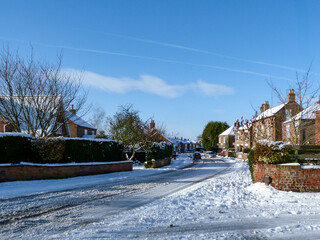 A snow covered street in the village of Riccall, North Yorkshire