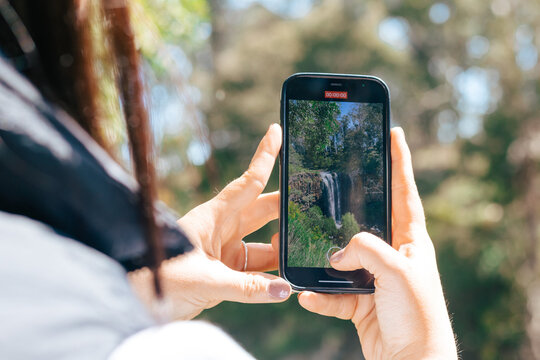 Taking photo of waterfall