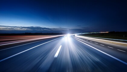 headlights on blurred highway at night