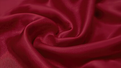 Obraz premium Luxurious dark red satin textile with soft, flowing wrinkles and a lustrous finish.