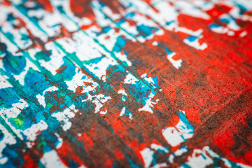 Extreme close up of colorful acrylic paint texture showing brush strokes. Selective focus.
