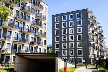 Contemporary building facade with some balconies. Close up of a modern apartment building.