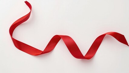 A flowing scarlet satin ribbon shaped into elegant loops on a pristine white surface. A clean and festive embellishment suitable for greeting cards, packaging, or advertising.