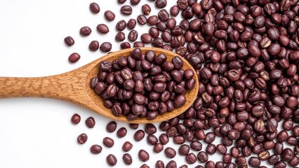 Obraz premium Natural wood spoon filled with violet beans alongside scattered pulses on a clean white backdrop. Wholesome plant-derived protein. Minimalist design for food advertising or cooking blog.