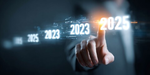 Obraz premium Businessman Selecting Future Year on Interactive Digital Timeline Representing Progress and Growth from 2025 to 2026