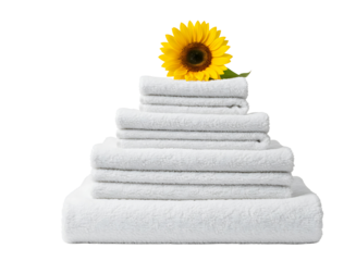 Stack of soft cotton bath towels in varying shades of blue and white topped 