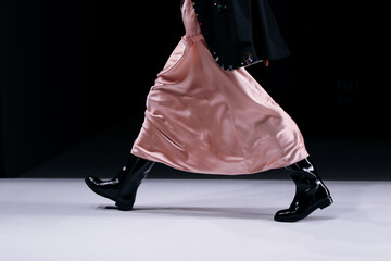 Casual women fashion, pink silk dress and black leather boots details, fancy clothes outfit on...