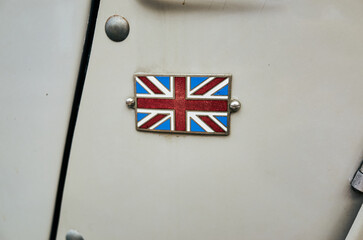 Small British flag is attached to a car door
