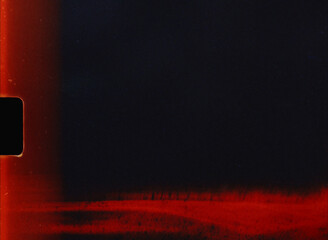 Light leaks and film grain creating a vintage film overlay background