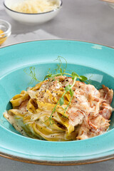 Carbonara pasta with bacon and cheese, bright lighting, overhead composition