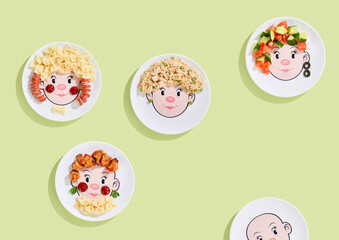 Childrens menu plates, bright lighting, overhead composition with playful food face arrangements