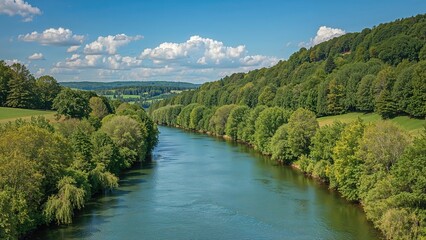 Peaceful countryside scene showcasing a river amidst vibrant green foliage and woodland