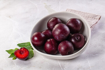 Raw ripe purple plum heap