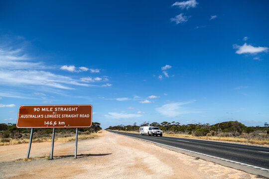 Caravan being towed along the 90 Mile Straight on the Eyre Highway on the Nullarbor
