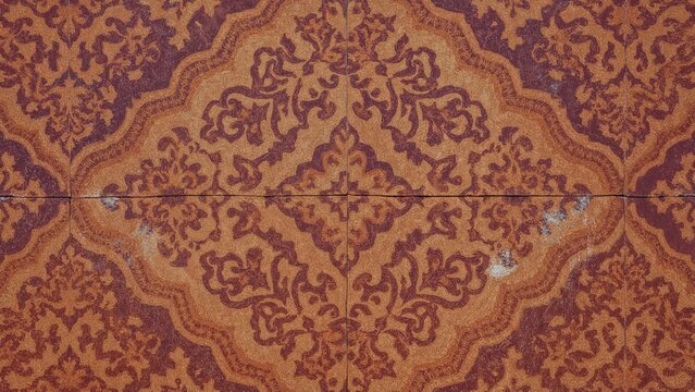 Retro geometric ornamental tile in bold orange and purple hues, suitable for abstract art, scrapbooking, and interior decoration.