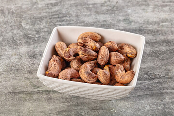 Unpeeled cashew nuts in the bowl