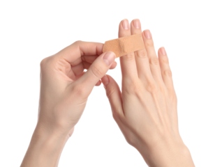 Hands starting to wrap a finger with a thin adhesive bandage strip
