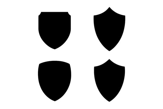 Set of 4 flat silhouette icons of protective shields. Knightly military shield insignia of different shapes. Vector elements for logo, emblem, crest, or security symbol.
