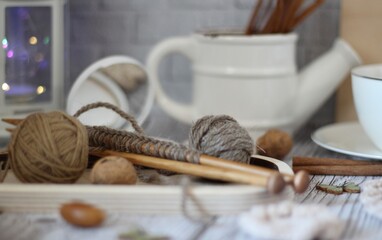 Needlework knitting objects on the table needles and clew ball wool yarn differen woman things...
