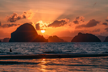 Orange sunset from Tubkaek Beach in Krabi Province, Thailand, with the islands of Than Bok Khorani National Park © AntonioLopez