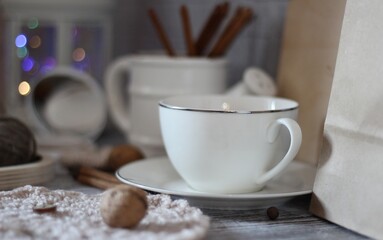 Decorative watering can flower pot crochet hooks collection table different handmade objects on the...