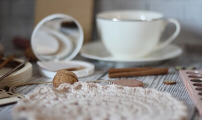  Woman's different things cup of tea, make up, ball clew yarn, mirror doily cozy photo beige pastel...