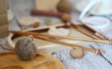 Needlework knitting objects on the table needles and clew ball wool yarn differen woman things...