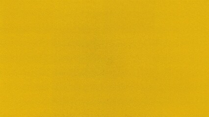 Obraz premium Close-up image of a yellow wall texture perfect for retro-style backgrounds.