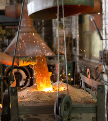 Foundry - ferrous metal is melted in an induction furnace of metallurgical plant
