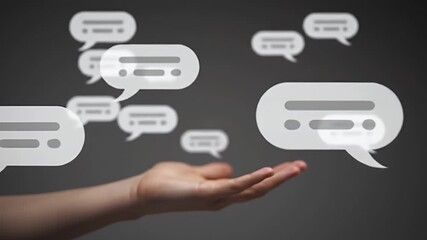 Outstretched Hand Presenting White Chat Bubbles Against a Gray Background for Business Communication and Digital Interaction Concepts
