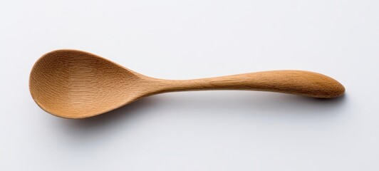 The wooden spoon on a clean white background for culinary elegance