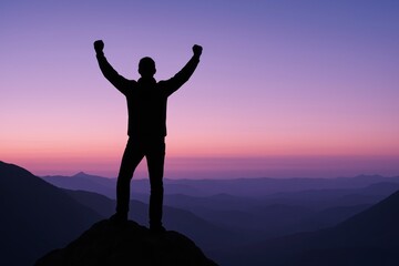 Fototapeta premium Silhouette of man raising arms atop mountain against colorful sky