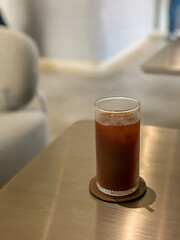 Iced coffee on a table in cozy modern cafe