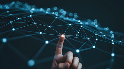 Human finger touching a glowing digital network of interconnected nodes and lines representing technology and data