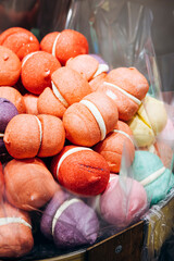 Colorful marshmallows and jelly candies displayed on store showcase.