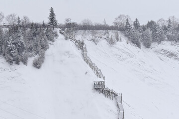 Winter landscape with snow-covered trees and ski slopes. Quebec, Canada.
