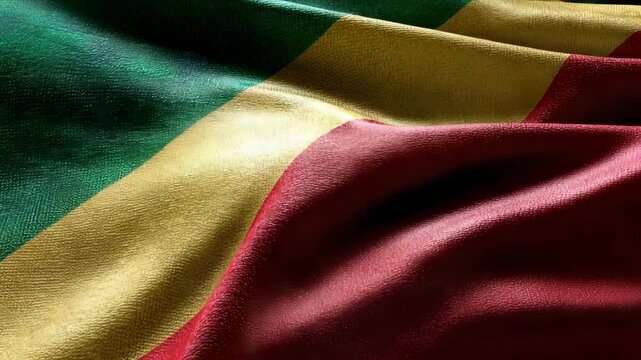 The flag of the Republic of the Congo displayed close up, showcasing the vibrant green, yellow, and red colors during independence day festivities.