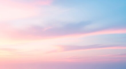 Fototapeta premium Soft pastel sunset sky with diffused clouds.
