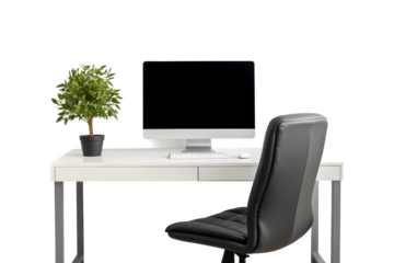 Modern workspace featuring sleek white desk, computer, comfortable chair, and plant for serene work environment