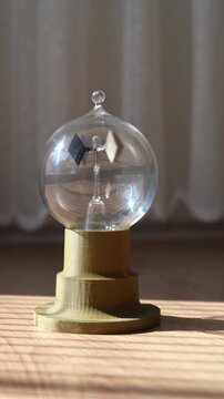 The radiometer is a four-bladed, freely rotating wheel placed in an airtight container. It measures the light energy falling on it.