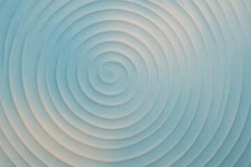 Radiating concentric spiral design in light blue forming a calming abstract ripple pattern used in visuals