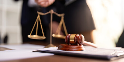 Legal Scales and Gavel on Office Desk