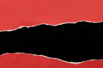 red torn paper on black background 