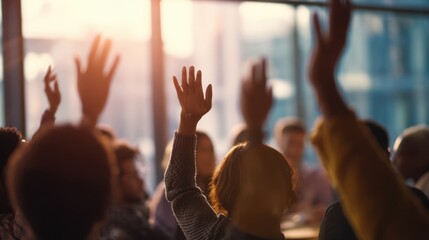 The group of people raising hands during an interactive meeting session.