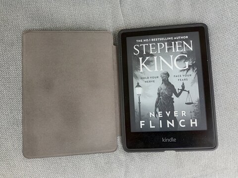 Kindle E-Reader with Stephen King's "Never Flinch" Displayed