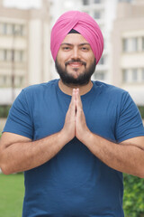 Vertical Photo of Sikh Indian Man Greeting Namaste